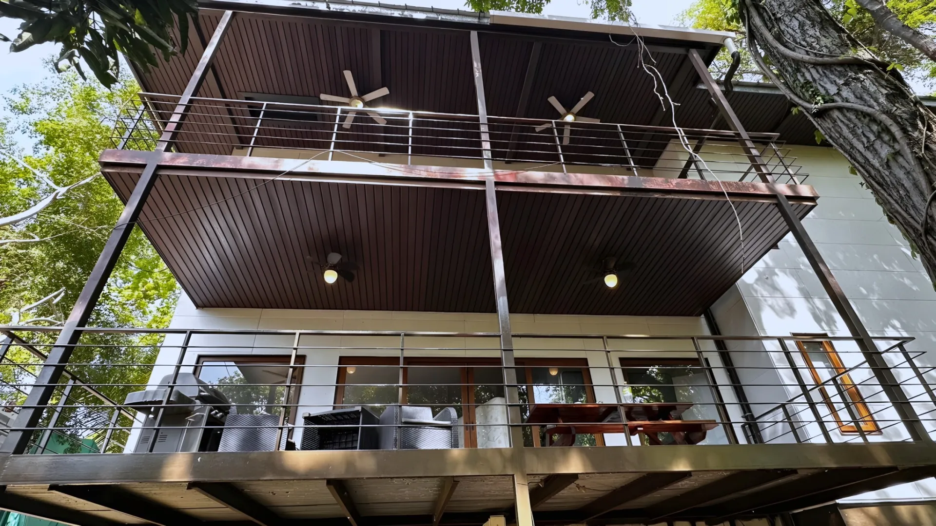 Covered terraces with ceiling fans at Gemini Villas